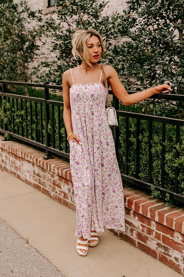 petite floral maxi dress Pastel with hint of gold neckline with delicate ruffle detailing for a feminine touch Voluminous long sleeves that create a romantic silhouette Flattering wrap Smiles and Sunshine Floral Maxi