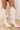 The Astrid Faux Leather Knee High Cowboy Boot in Ivory Orange Sideline Social High Waist Sequin Shorts in Orange 