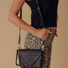 Sweet Melody Woven Faux Leather Clutch in Black Image - 1