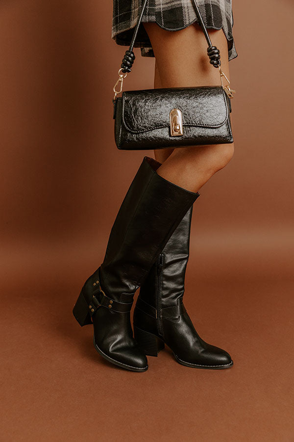 The Elliana Faux Leather Knee High Boot In Black