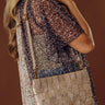 Mimie Vegan Leather Woven Crossbody Bag in Rose Gold Image - 1
