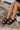  black The Kiara Faux Leather Sandal in Black 