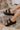  black The Kiara Faux Leather Sandal in Black 