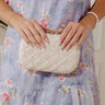 The Rya Faux Leather Woven Clutch in Cream Image - 1