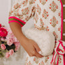 The Rya Faux Leather Woven Clutch in Cream Image - 1