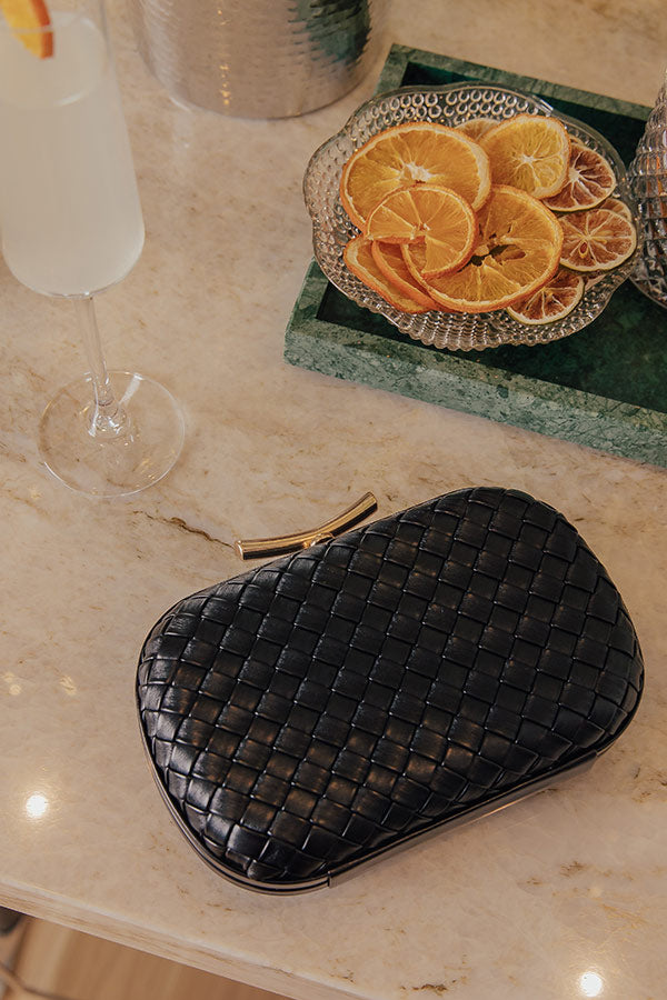 Allison Faux Leather Woven Clutch in Black