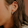 Glimmering Smile Baguette Huggie Hoop Earrings Image - 1