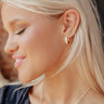 Glimmering Smile Baguette Huggie Hoop Earrings Image - 1