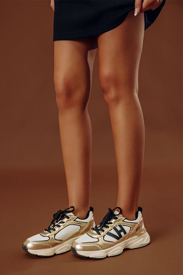 The Dash Faux Leather Sneaker in Gold
