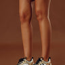 The Dash Faux Leather Sneaker in Gold Image - 1