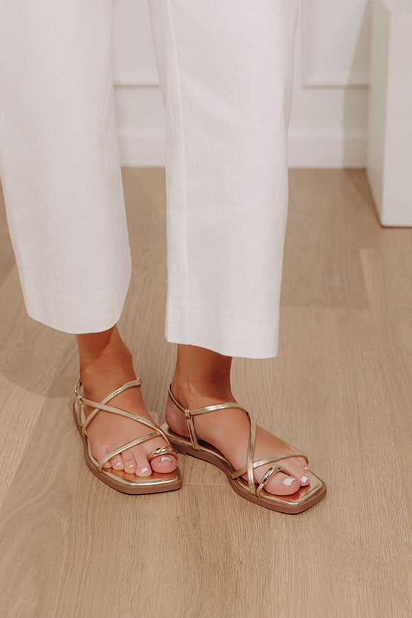 The Lucia Faux Leather Metallic Sandal in Gold