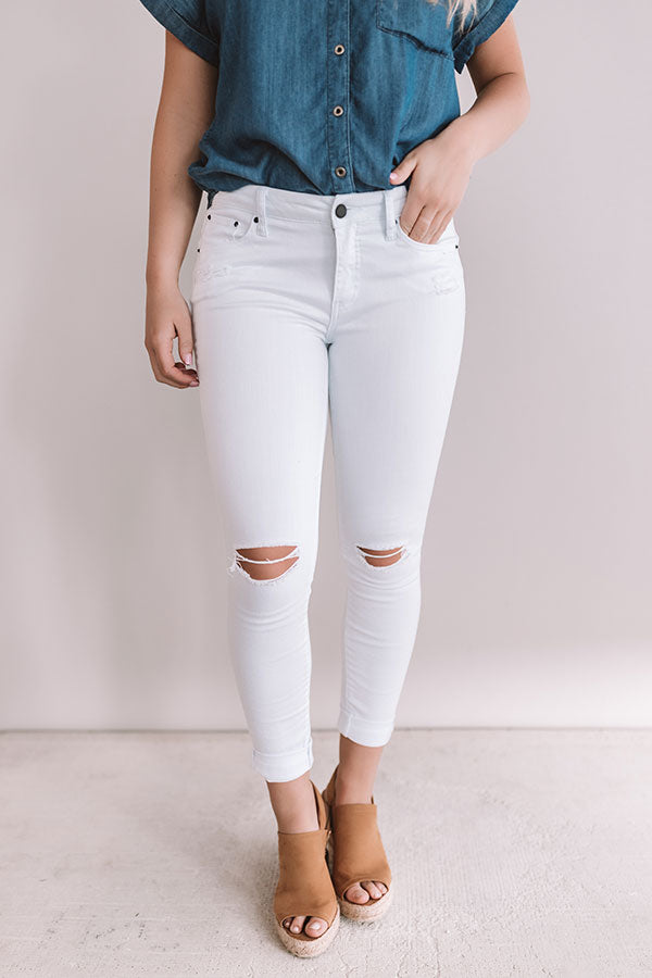 The Reyna Midrise Distressed Ankle Skinny