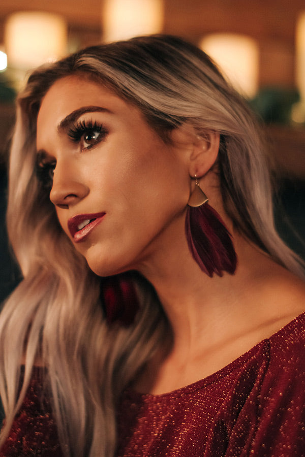 Feeling Flirtatious Feather Earrings In Wine