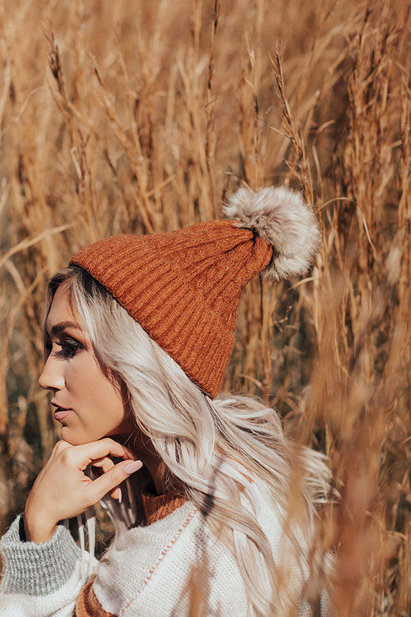 In The Know Faux Fur Pom Beanie In Dark Rust