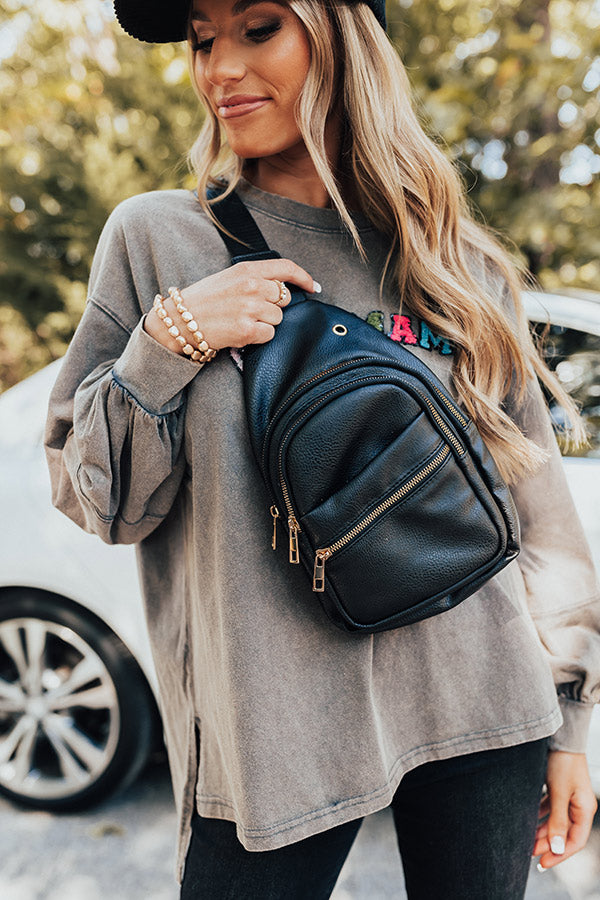 Highway Home Faux Leather Sling Backpack In Black • Impressions