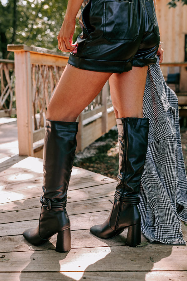The Eliana Faux Leather Knee High Boot In Black